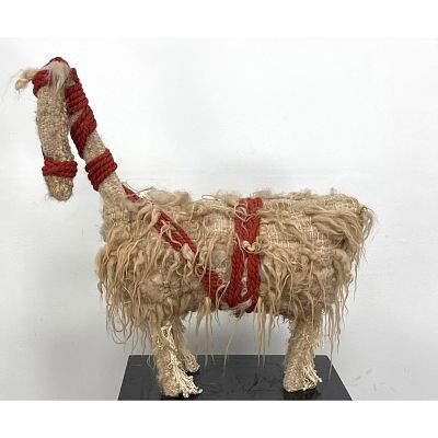 Hand Woven Textile Llama Sculpture with Shaggy Wool Fleece and Braided Red Cord Harness. 