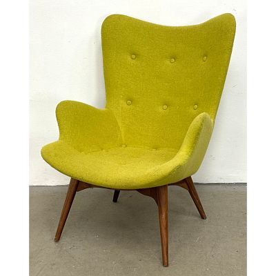 Contemporary Modern Sculpted Back Lounge Chair. Tapered Wood Legs with Cross X Construction. 