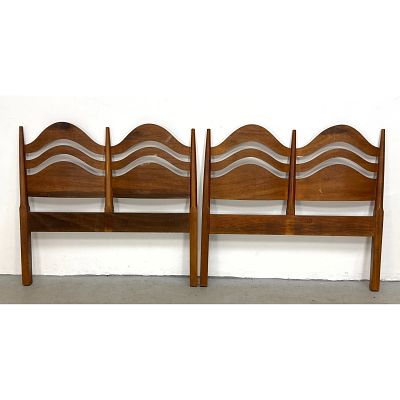 Pair of mid-century modern twin size wooden headboards featuring sculptural undulating wave 