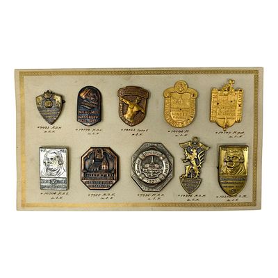 Third Reich Nazi Tinnies on Original Salesman Card. Mounted display of ten commemorative badges 