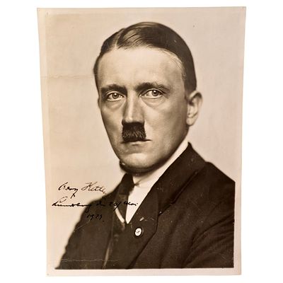 Adolf Hitler Signed Photograph with Hoffmann Studio Backstamp. A sepia-toned bust portrait 