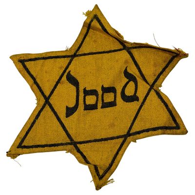 Dutch 'Jood' Star of David Cloth Badge - Holocaust Era. A yellow cloth Star of David badge 