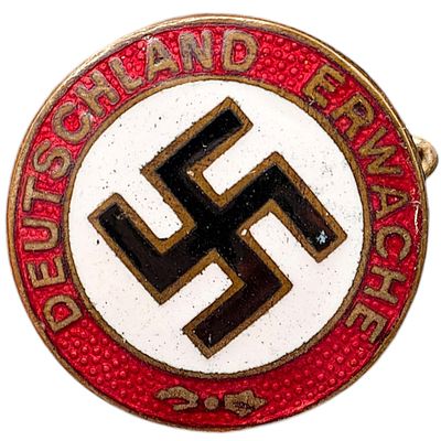 NSDAP Early Slogan Badge Nun Erst Recht. A round pin-back badge with red enamel border reading 