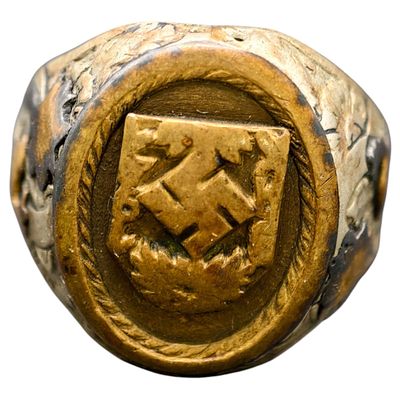 Third Reich Afrika Korps Ring. A cast metal ring featuring an oval bezel with a shield-shaped 