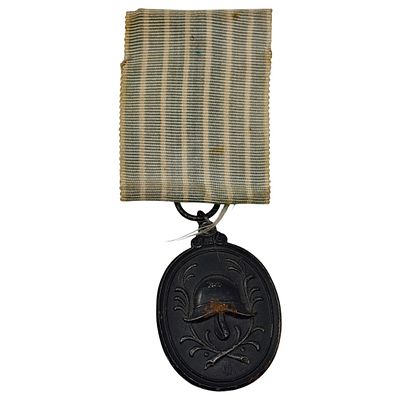 German Fire Brigade 25-Year Long Service Medal. An oval medal in a dark-toned metal, one side 