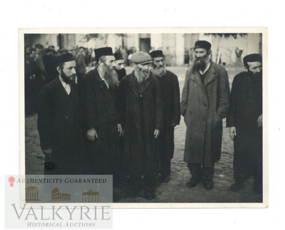 Lot 234: Photo of a Group of 7 Orthodox Jews Gathered Probably by Germans in a Ghetto