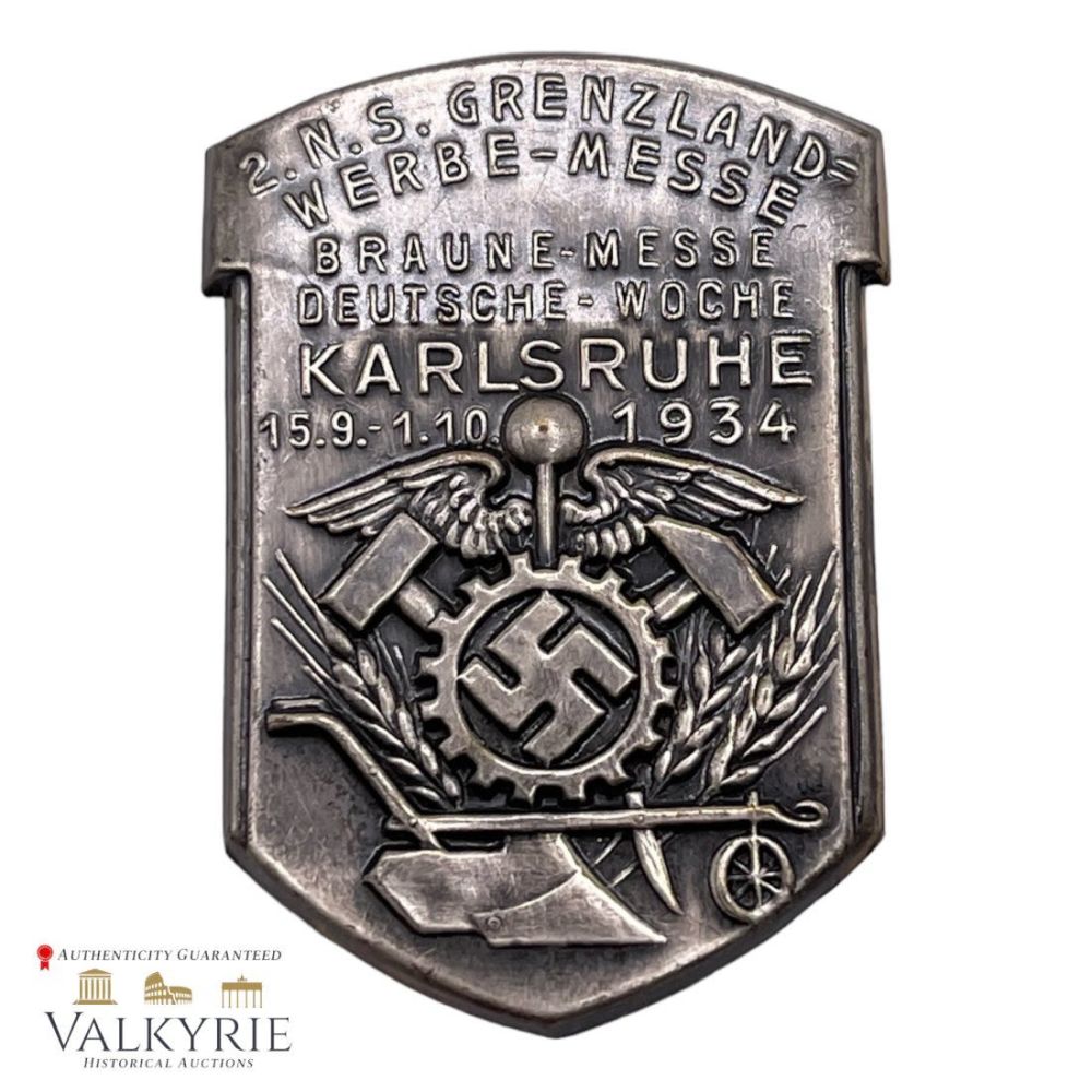 Lot 311: Early Rare Nazi Badge "1934 Karlsruhe Border-Counties Braune Messe"