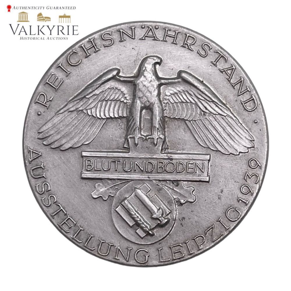 Lot 328: Rare Nazi Badge "Reichsnahrstand/Blood And Soil Leipzig Exhibition Badge By Deschler u.S Munchen 9"