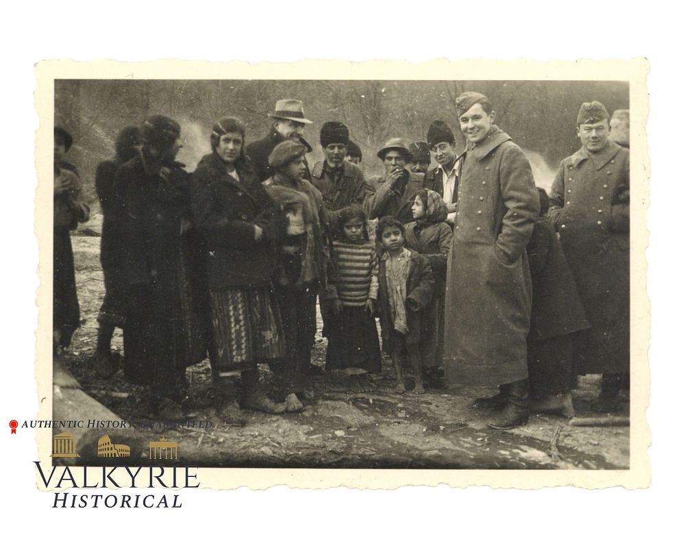 Lot 251: Private Taken Photo of a Gypsy Family From Poland Posing With 2 German Uniformed Men