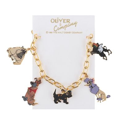 An "Oliver & Company" Charm Bracelet. (Disney, 1988) A gold-tone "Oliver &amp; Company" charm 
