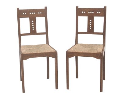 Jacob Pieter van den Bosch (1868-1948) Two oak chairs with openwork backs and loose rush seats 