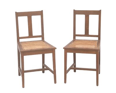 't Binnenhuis, Amsterdam Two oak chairs with rattan seats, a design attributed to Lambertus 