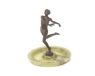 Josef Lorenzl (1892-1950) A sculpture of a dancing nude woman on a round plate-shaped onyx base 