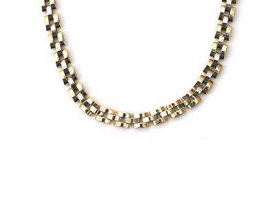 Een 14 krt. bicolor gouden rolexschakel collier Bestaande uit witgouden en geelgouden schakels. 