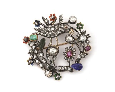 Een 18 krt. geelgouden met zilveren broche met diamant en diverse edelstenen Ronde opengewerkte 