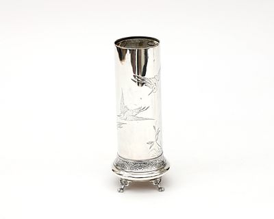 Tiffany & Co A silver vase with an engraved decoration of three birds in a landscape with 