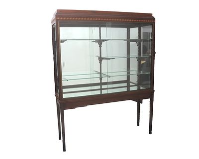 Art Deco A two-piece hardwood display cabinet with two sliding glass doors and five glass 