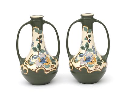 N.V. Arnhemsche Fayencefabriek Two polychrome painted ear vases with floral decor, model 151 