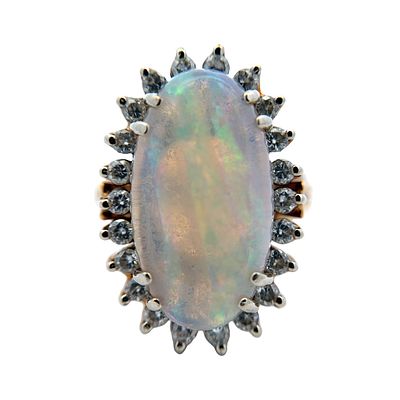 Oval Opal and Diamond Ring in 18K Yellow Gold. Metal type: 18k yellow gold, Gemstones: Oval opal