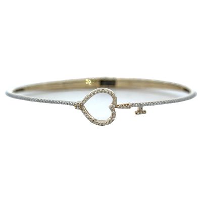 10K Gold Diamond Hinged Bangle Bracelet. 10 karat yellow gold hinged bangle bracelet with 105