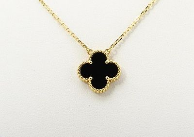 Van Cleef & Arpels Vintage Alhambra Black Onyx Pendant Necklace in Yellow Gold. Title/Medium: 
