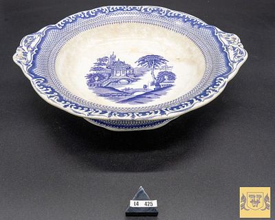 Uncovered Plate in Porcelain. European, marked at the base, with handles on the edge and 