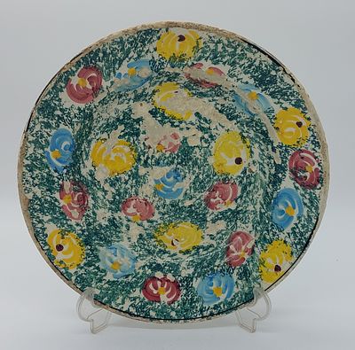 Deep Plate in Portuguese Faience
. Polychrome decoration on a glazed beige background, with 