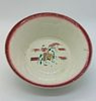Basin in Portuguese Faience
. Edge edged in red with signs of use in the center with polychrome 