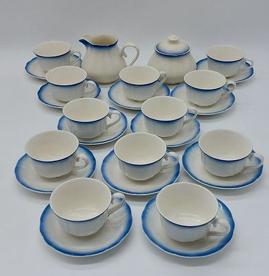 Part of a Tea Service in Portuguese Earthenware
. Marked on the base Sacav&eacute;m, sugar bowl, milk 