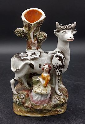 Faience toothpick holder
. European, sculpture representing a cow and a girl milking it, the cow 