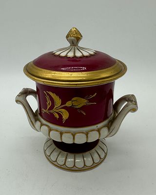 Porcelain urn
. Molded and relief from the Artibus factory, marked on the base, polychrome and 