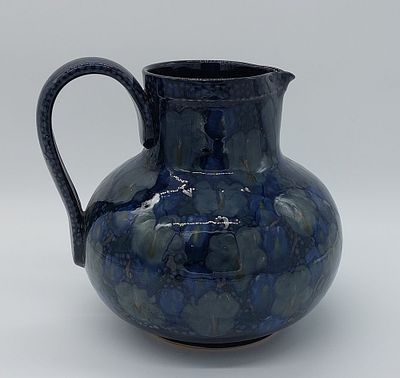 Portuguese Faience Pitcher
. Marked on the base, modernist decoration in good condition. 
