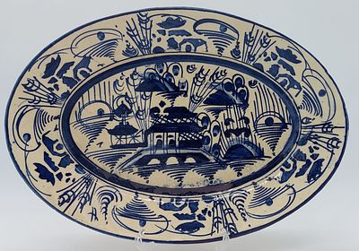 Faience platter
. Portuguese, Canton blue decoration on a white glazed background with wear and 