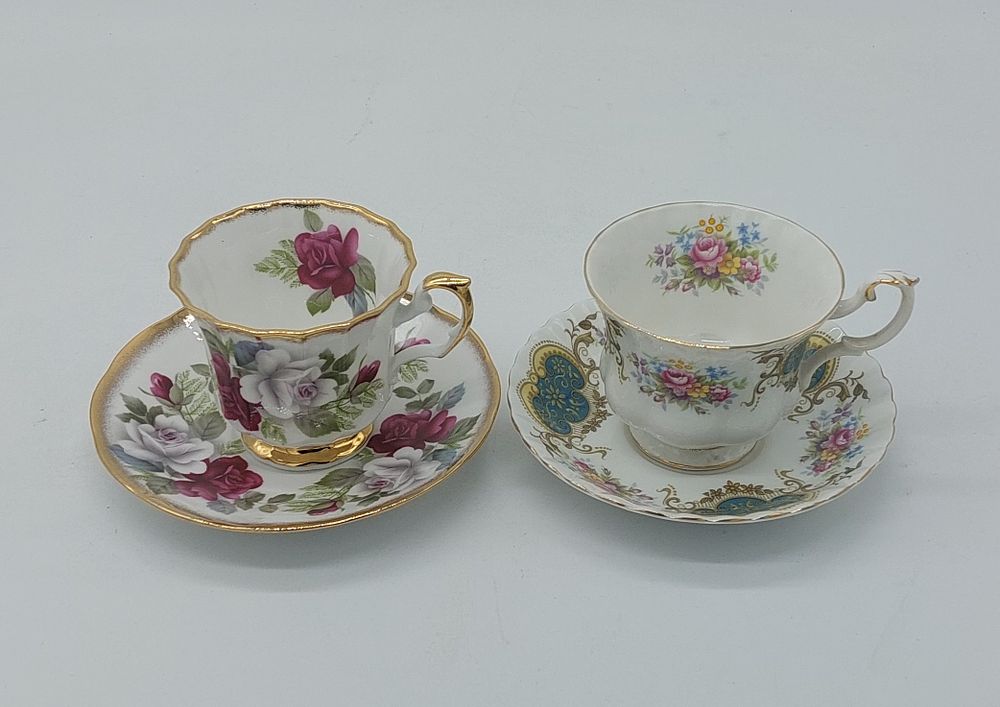 Two European Porcelain Cups
. Molded and embossed, marked on the base, Royal Albert and Queen's 
