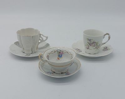Three European Porcelain Cups
. Molded and embossed, unmarked, various models with polychrome