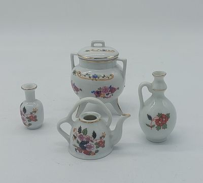 Four Pieces in Portuguese Porcelain
. Molded and embossed, marked on the base, three Porart and