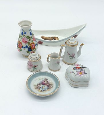 Assortment of 7 Pieces in Portuguese Porcelain
. Molded and embossed, marked on the base, with