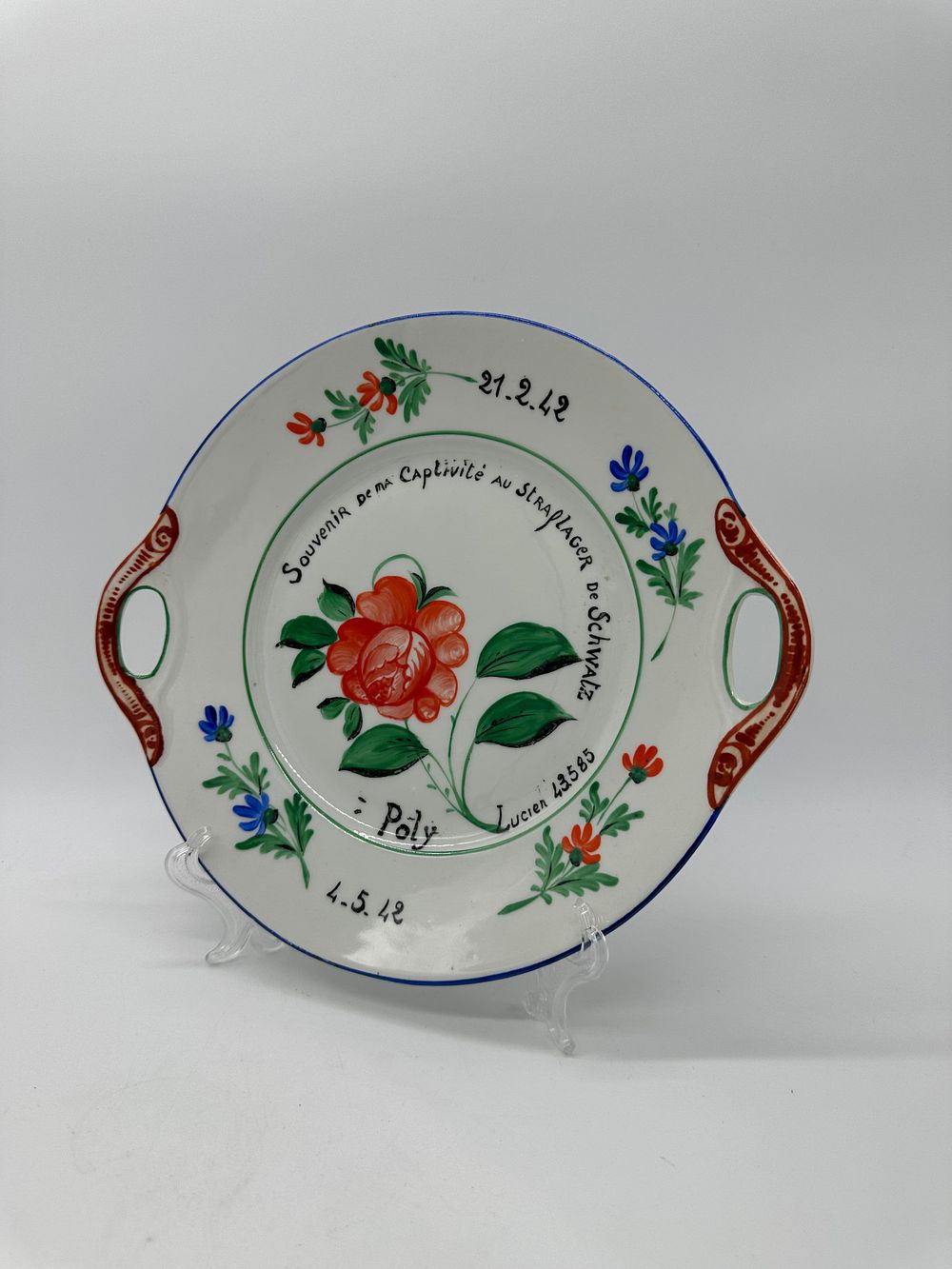 European Porcelain Toast Plate
. Blue edged edge, polychrome floral decoration on a white glazed 