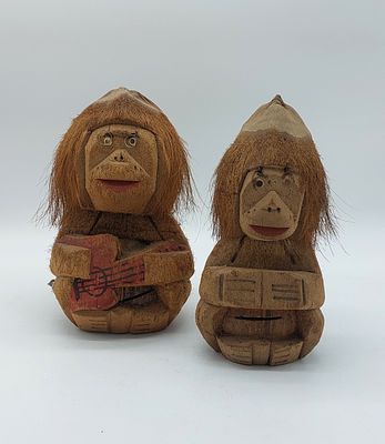 Coconut Crafts
. Pair of sculptures representing seated animals with relief carving showing