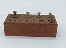 Wooden Block with Weights
. Rectangular body with eleven round cavities of various shapes with Image - 1