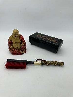 Three Oriental Pieces
. Sculpture representing Buddha, brush and jewelry box in lacquered wood