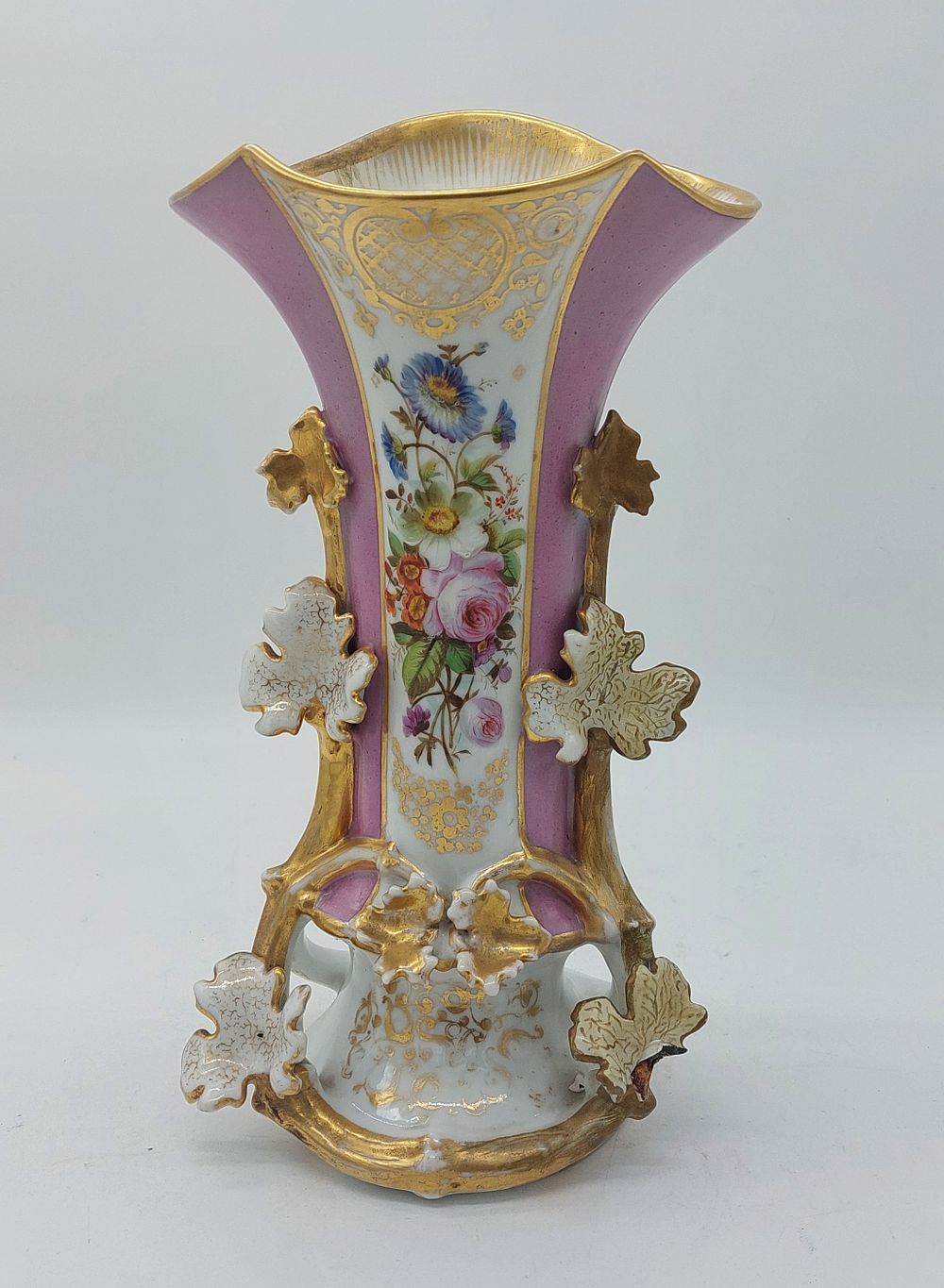 Porcelain vase. Old Paris style porcelain vase with wavy rim and gold trim, with leaf-shaped 