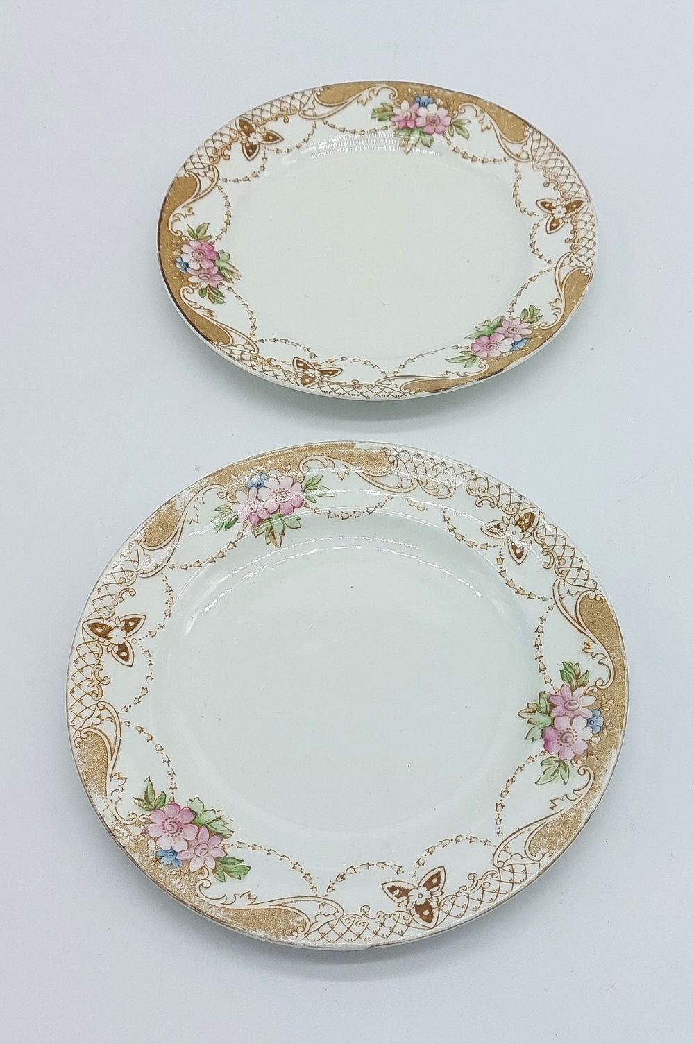 Two Oriental Porcelain Dessert Plates
. Molded and relief, marked on the base, edge with floral 