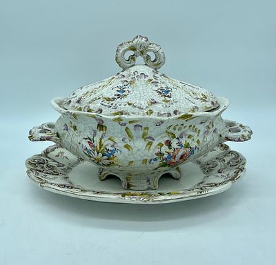 Faience tureen with lid and platter. White earthenware, moulded and relief, hand-painted with