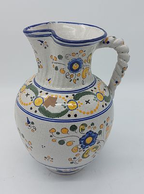 Antique Spanish faience jug
. Antique Spanish faience jug. Piece with a bulbous body, wavy rim
