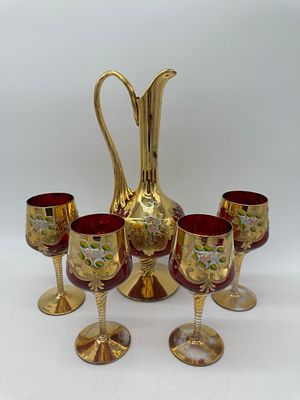 Murano Glass Pitcher and Four Glasses
. Hand painted with polychrome floral decoration on a gold