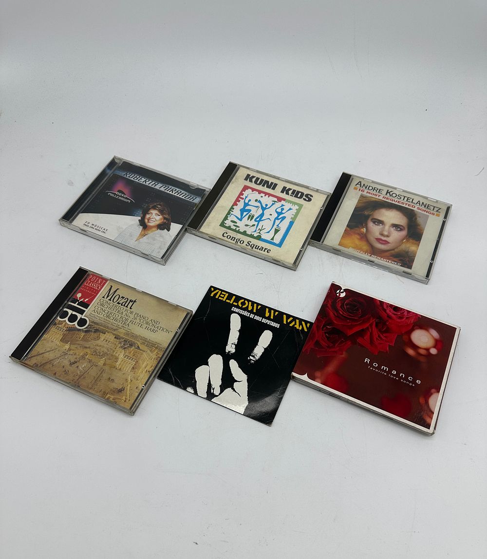 Six diverse CDs: 
1. 'Congo Square' by Kuni Kids; 
2. 'Concerto for Piano and Orchestra No. 26 