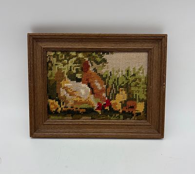 Frame with embroidery. Rectangular wooden frame with embroidery depicting roosters and hens. The 