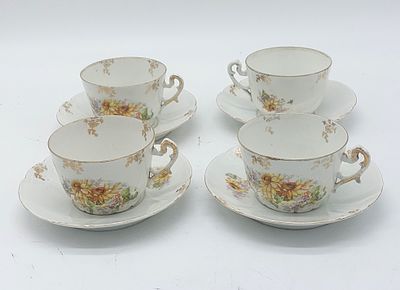 Four Porcelain Tea Cups
. Molded and embossed, unmarked, four cups and saucers, edges edged in 