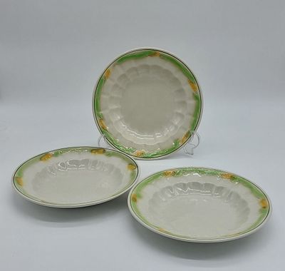 Three Deep Plates in Portuguese Faience
. Marked on the base, Sacavém, edge edged in green 